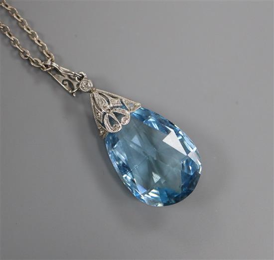 A white metal and teardrop-shaped aquamarine pendant with diamond-set suspension on sterling chain, pendant 28mm.